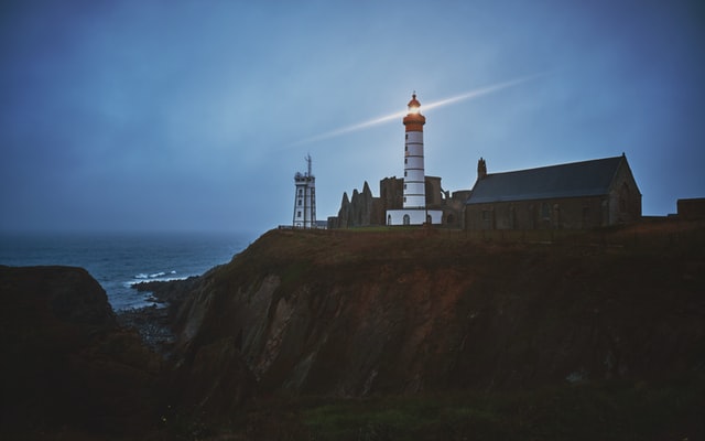 Lighthouse On The Edge Of The Ocean